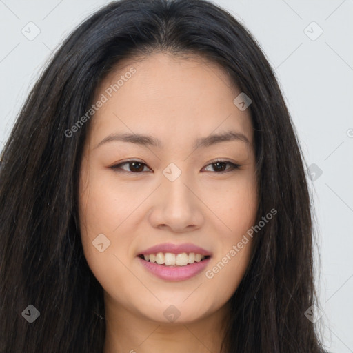 Joyful asian young-adult female with long  brown hair and brown eyes