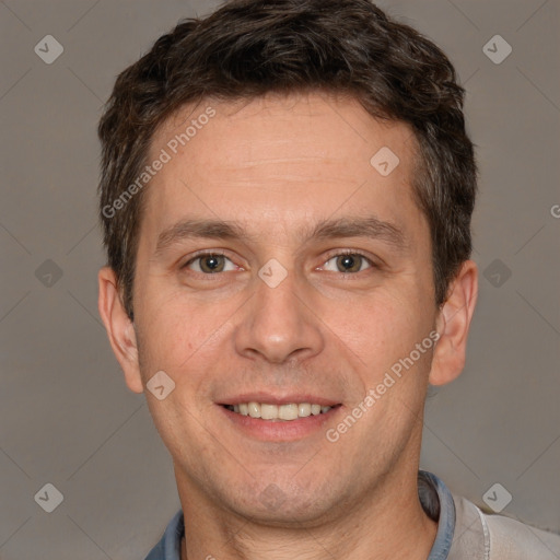 Joyful white adult male with short  brown hair and brown eyes