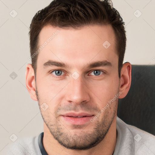 Neutral white young-adult male with short  brown hair and grey eyes