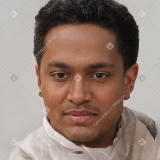 Joyful black young-adult male with short  black hair and brown eyes