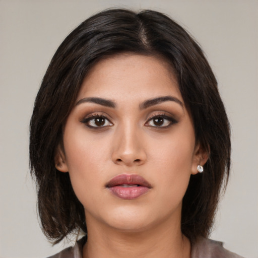 Neutral asian young-adult female with medium  brown hair and brown eyes