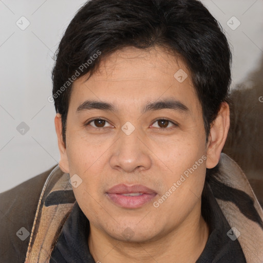 Joyful white adult male with short  black hair and brown eyes