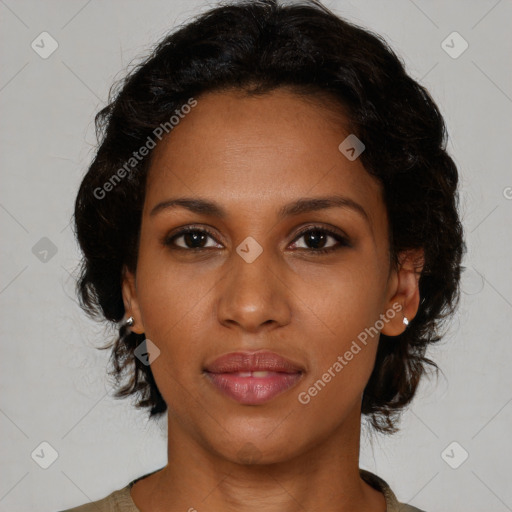 Joyful black young-adult female with medium  brown hair and brown eyes