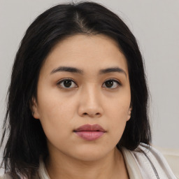 Neutral asian young-adult female with medium  brown hair and brown eyes