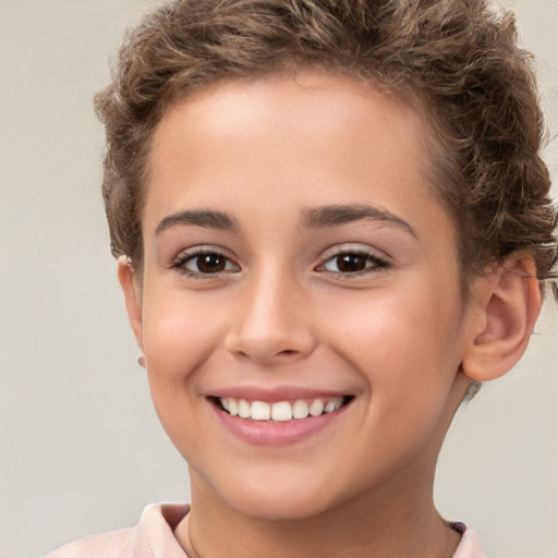 Joyful white child female with short  brown hair and brown eyes