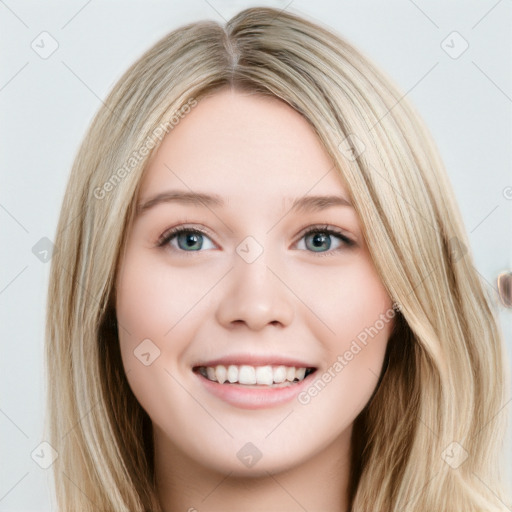 Joyful white young-adult female with long  brown hair and blue eyes