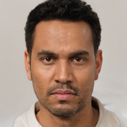 Neutral white young-adult male with short  black hair and brown eyes