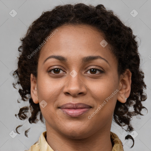 Joyful black young-adult female with medium  brown hair and brown eyes