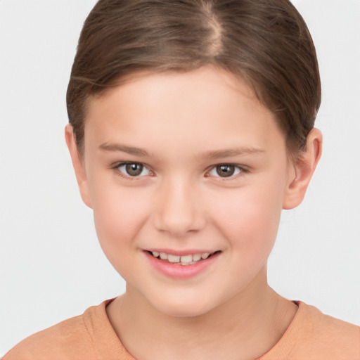 Joyful white child female with short  brown hair and brown eyes