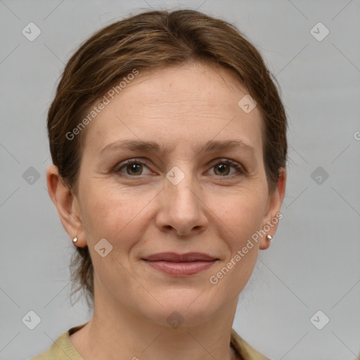 Joyful white adult female with medium  brown hair and grey eyes