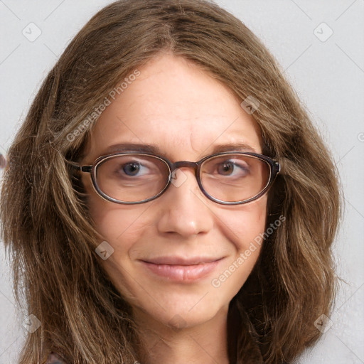 Joyful white adult female with long  brown hair and brown eyes