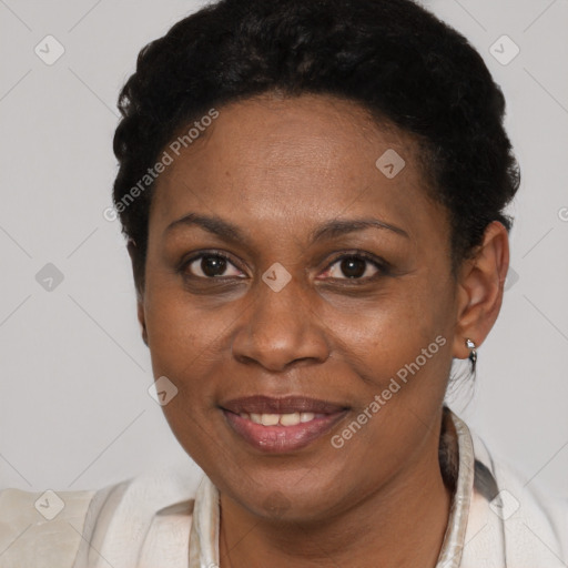 Joyful black adult female with short  brown hair and brown eyes