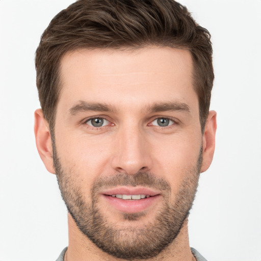 Joyful white young-adult male with short  brown hair and brown eyes