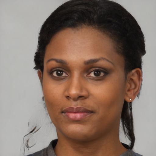 Neutral black young-adult female with medium  black hair and brown eyes