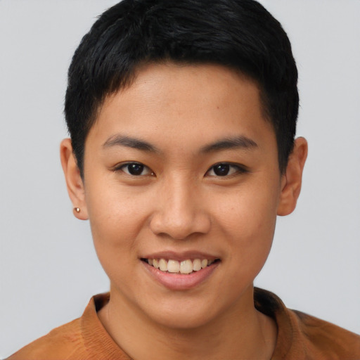 Joyful asian young-adult female with short  black hair and brown eyes