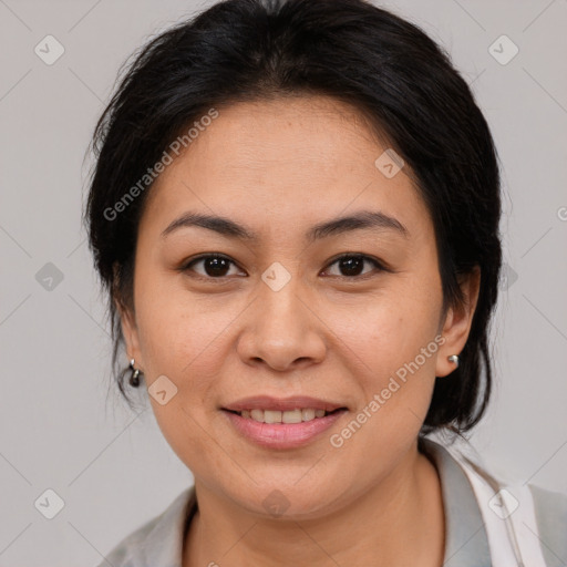 Joyful latino young-adult female with medium  brown hair and brown eyes