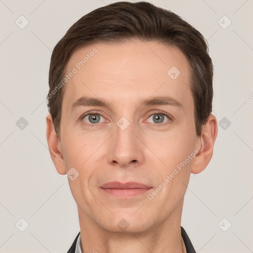 Joyful white adult male with short  brown hair and grey eyes