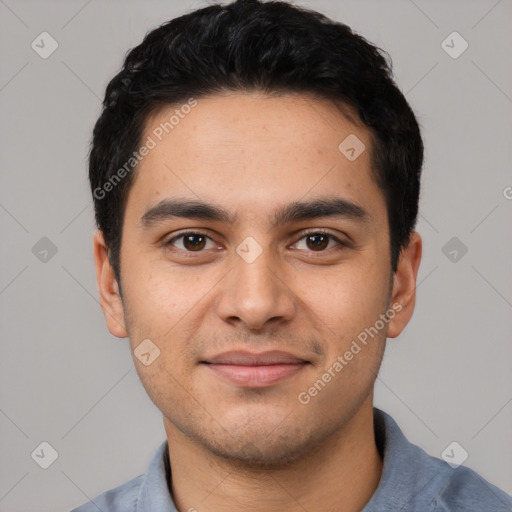 Joyful latino young-adult male with short  black hair and brown eyes