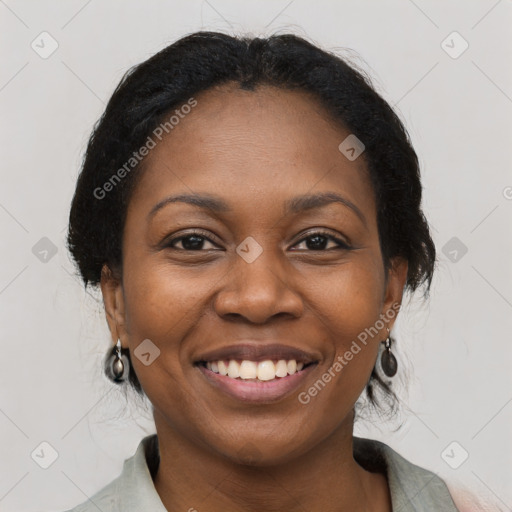 Joyful black young-adult female with medium  brown hair and brown eyes