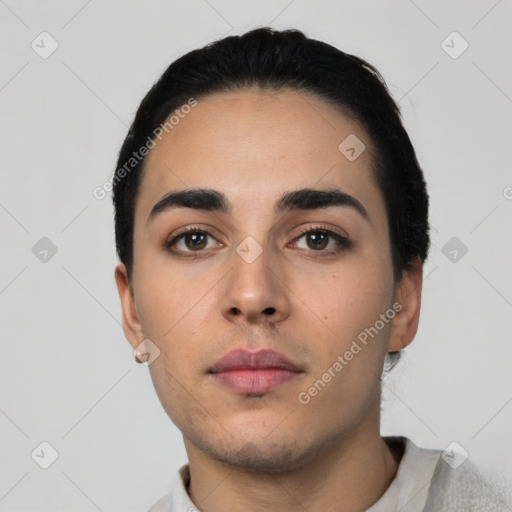 Neutral latino young-adult male with short  black hair and brown eyes