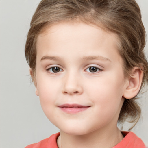 Joyful white child female with medium  brown hair and brown eyes