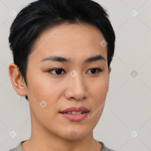 Joyful asian young-adult female with short  brown hair and brown eyes