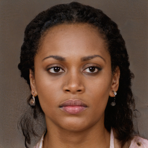 Neutral black young-adult female with long  brown hair and brown eyes