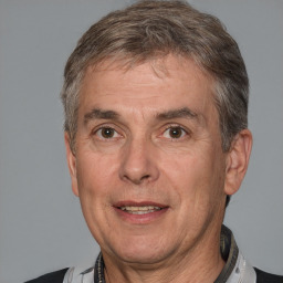 Joyful white middle-aged male with short  brown hair and brown eyes