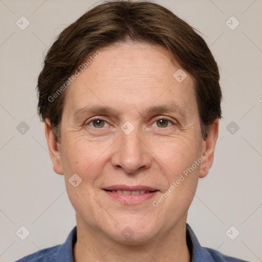 Joyful white adult male with short  brown hair and grey eyes