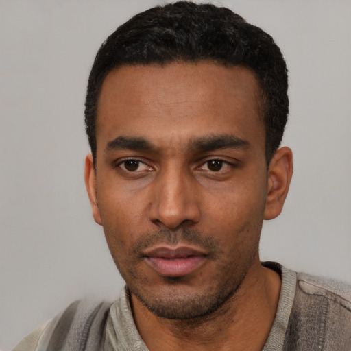 Neutral latino young-adult male with short  black hair and brown eyes