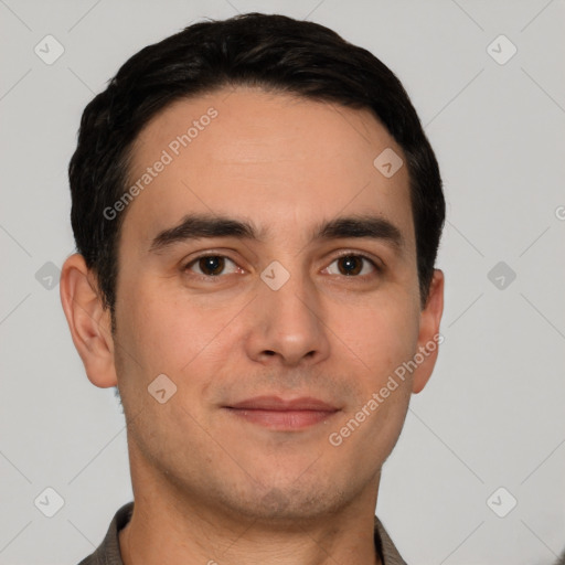 Joyful white young-adult male with short  black hair and brown eyes