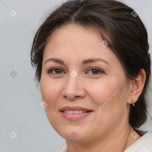 Joyful white adult female with medium  brown hair and brown eyes