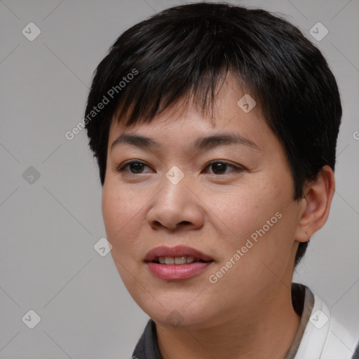 Joyful asian young-adult female with short  brown hair and brown eyes