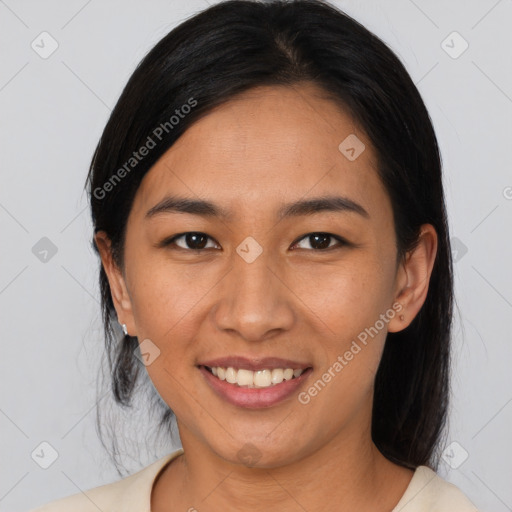 Joyful asian young-adult female with long  black hair and brown eyes