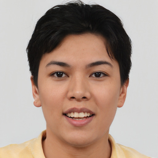Joyful asian young-adult female with short  brown hair and brown eyes