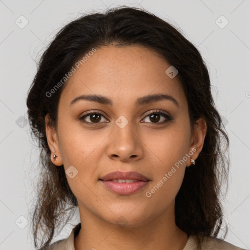 Joyful latino young-adult female with long  brown hair and brown eyes