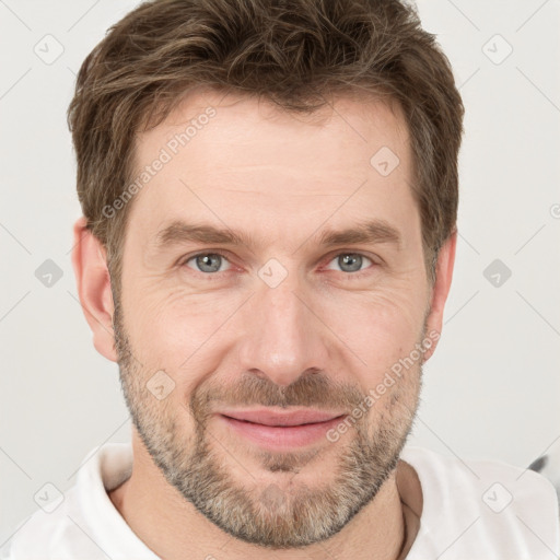 Joyful white adult male with short  brown hair and grey eyes