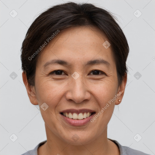 Joyful white adult female with short  brown hair and brown eyes