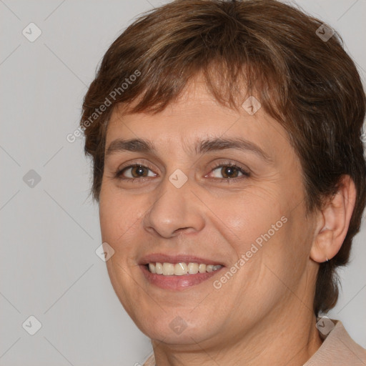 Joyful white adult female with medium  brown hair and brown eyes