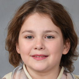 Joyful white child female with medium  brown hair and brown eyes