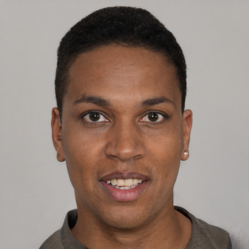 Joyful black young-adult male with short  black hair and brown eyes