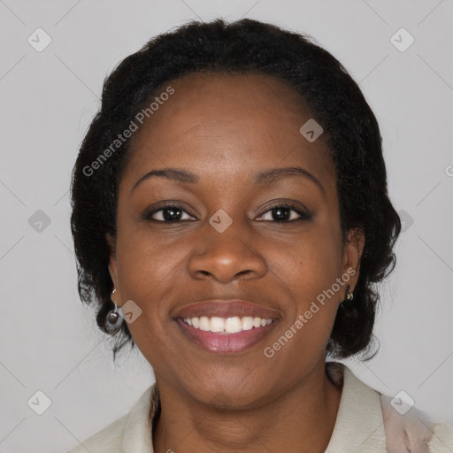 Joyful black young-adult female with medium  black hair and brown eyes