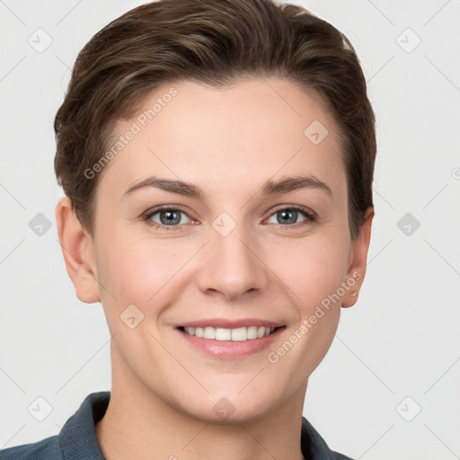 Joyful white young-adult female with short  brown hair and grey eyes