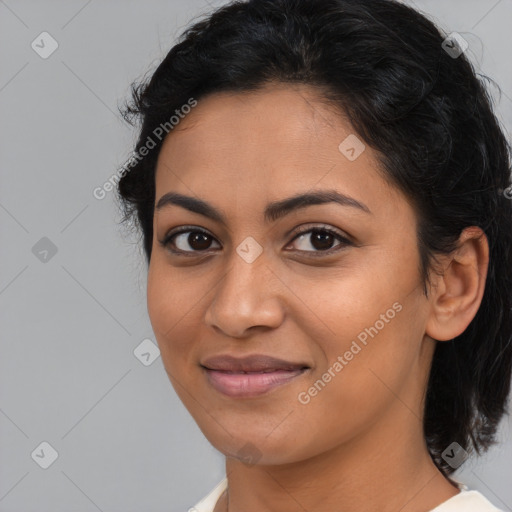 Joyful latino young-adult female with medium  brown hair and brown eyes