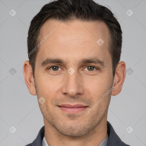 Joyful white adult male with short  brown hair and brown eyes