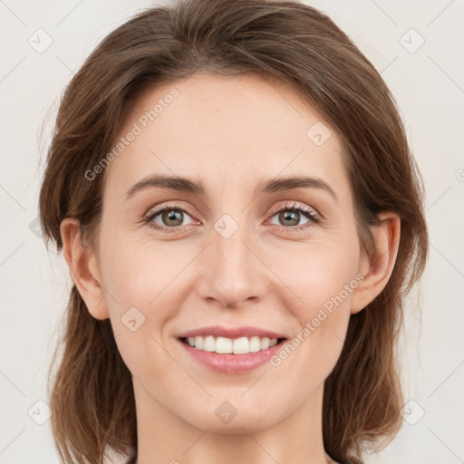 Joyful white young-adult female with medium  brown hair and green eyes