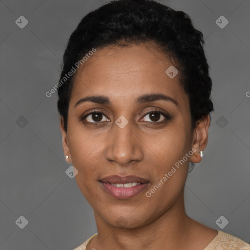 Joyful latino young-adult female with short  black hair and brown eyes