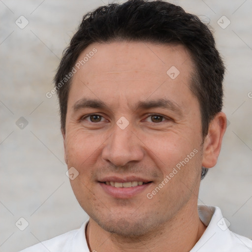 Joyful white adult male with short  brown hair and brown eyes