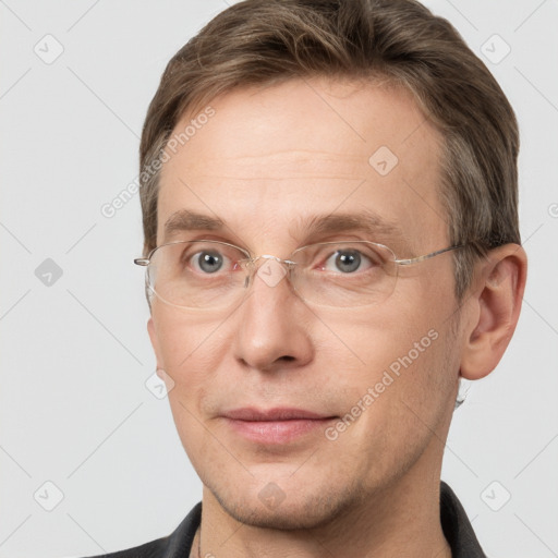 Joyful white adult male with short  brown hair and grey eyes