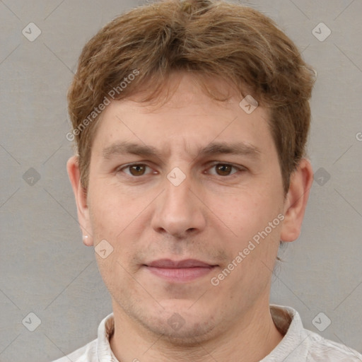 Joyful white adult male with short  brown hair and brown eyes